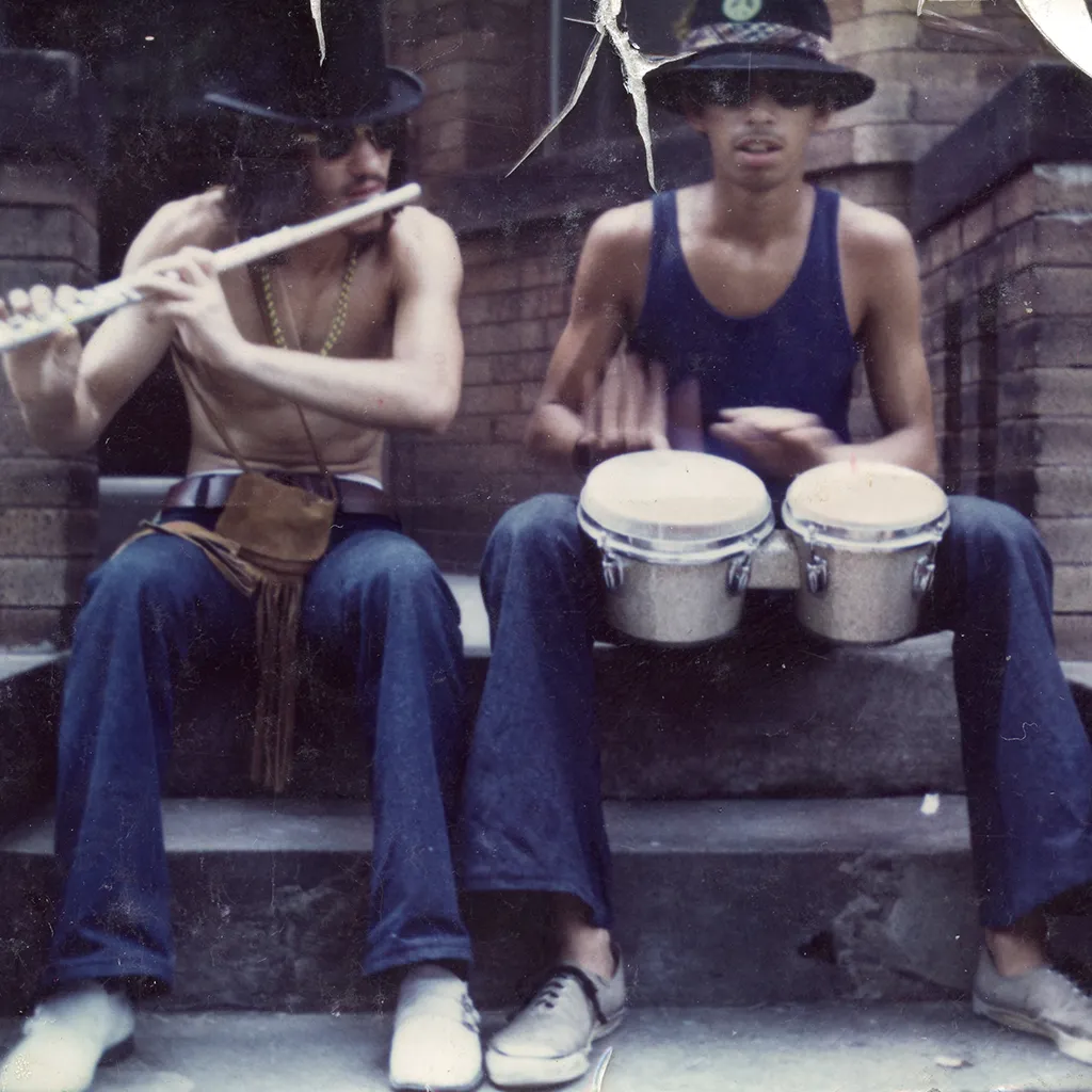 Two musicians jamming on a stoop