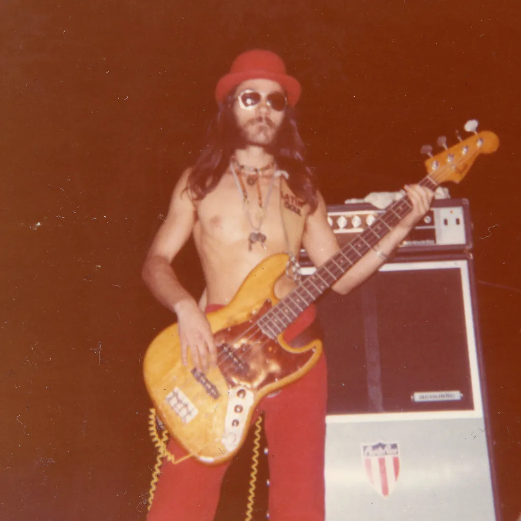 Musician playing electric bass guitar